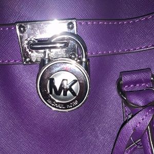 Like-new big purple Michael Kors hand bag.